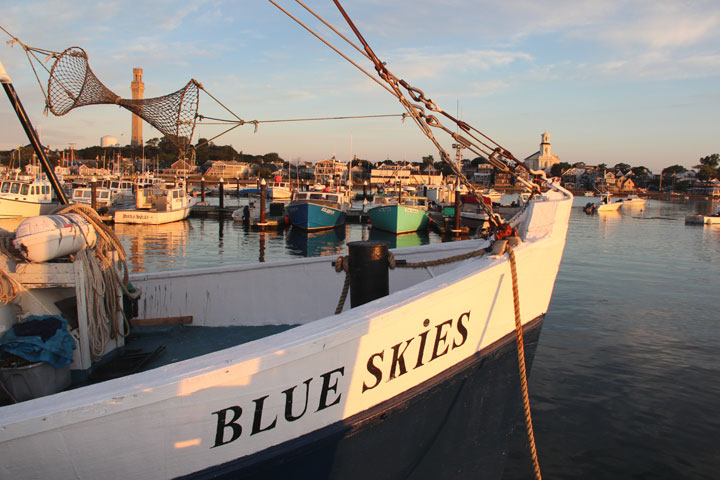 Provincetown Harbor, August 25, 2012 sunrise... Blue Skies with Provincetown Public Library and Pilgrim Monument on the horizon...