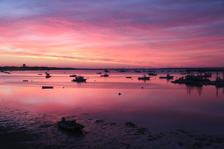 July 31, 2012 Sunrise over MacMillan Pier, fishing boats going to sea, fishermen working, people at coffee shop